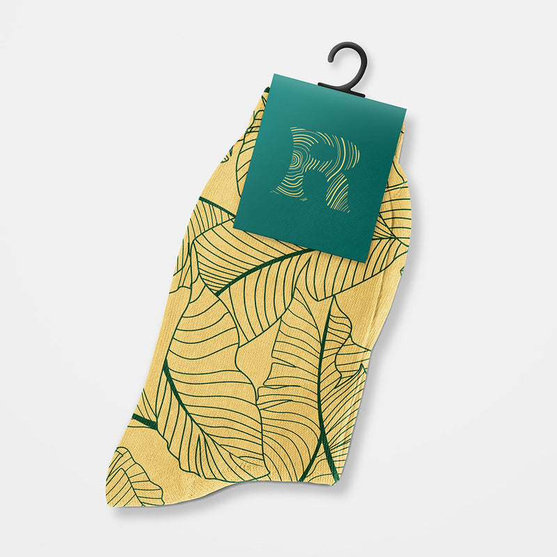 Custom Socks featuring green leaf pattern with a custom label, ideal for branding and corporate events.